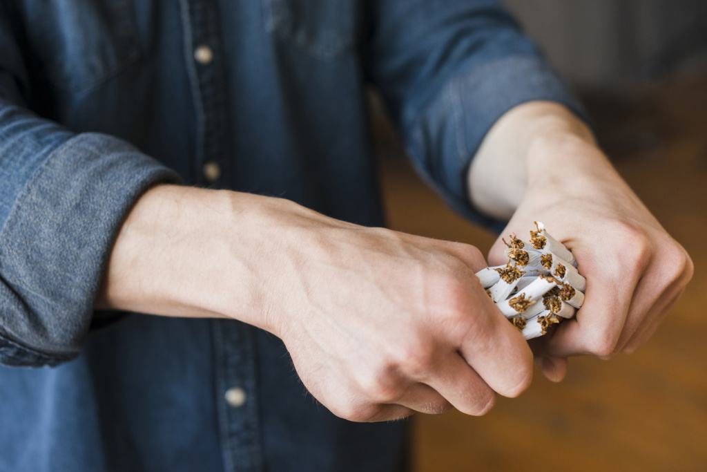 close-up-human-hand-breaking-bundle-cigarettes.jpg close-up-human-hand-breaking-bundle-cigarettes.jpg